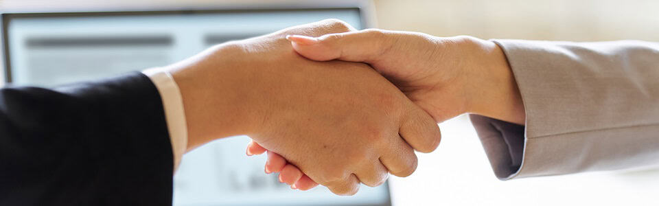 Business people shaking hands at a meeting
