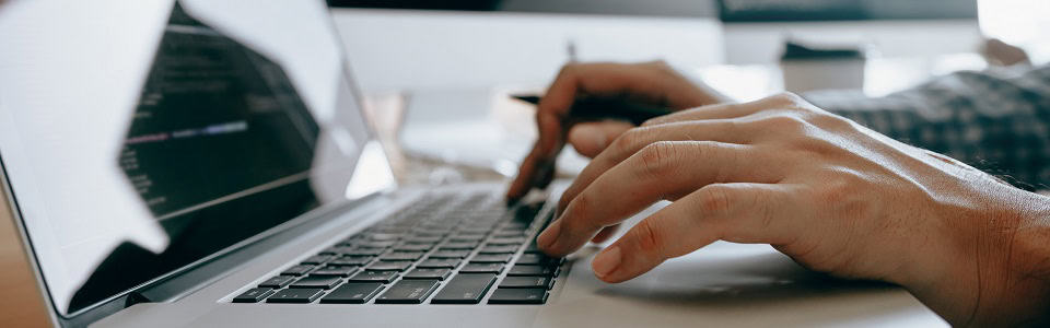 Close up of hands contemporary website developer man typing and